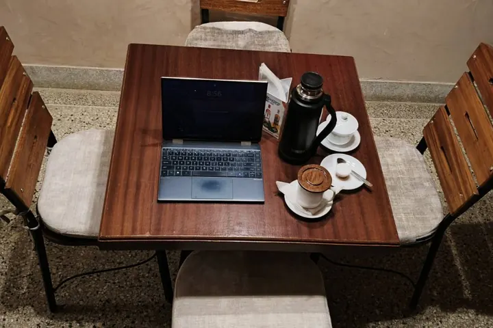A quiet work table with coffee at Kenlife